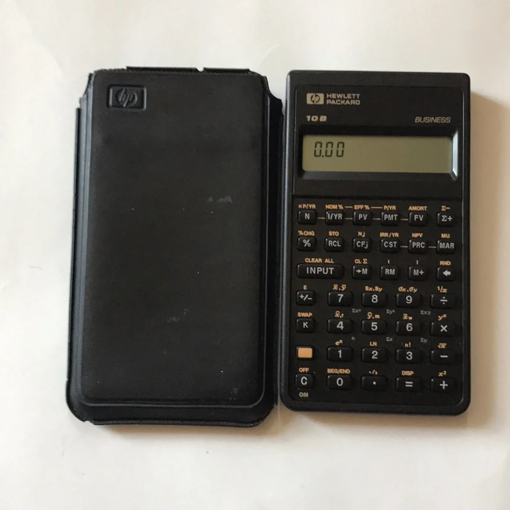 Vintage Hewlett-Packard 10b Business calculator with manual